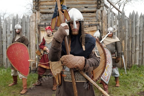 Preview: Medieval Warriors Guarding Fort Entrance in Armor and Helmets