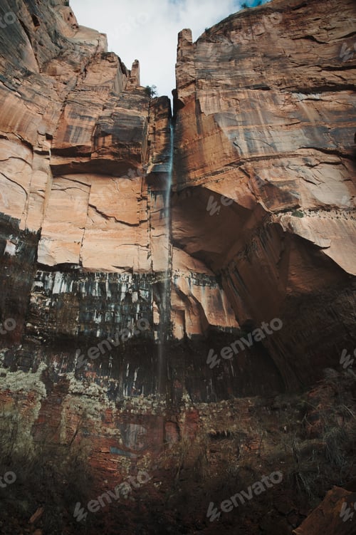Preview: Waterfall cascading down canyon wall in Zion National Park in the early Spring