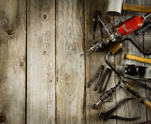 Preview: Various tools on a wooden background.