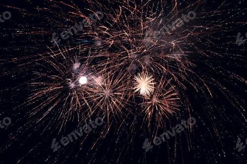 Preview: Beautiful shot of bright fireworks in a night sky