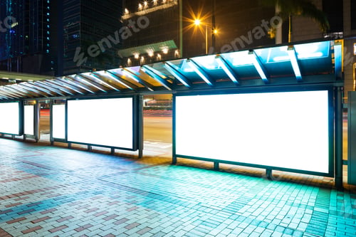 Preview: Night bus station with blank billboard