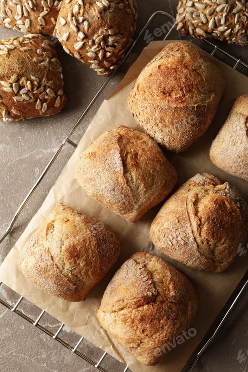 Preview: Cooling rack with fresh baked buns on gray background
