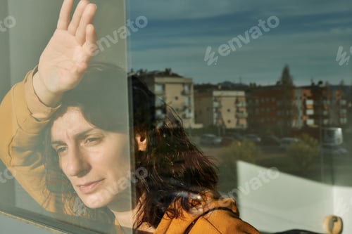 Preview: A young woman during confinment, quarentine by coronavirus - virus concept
