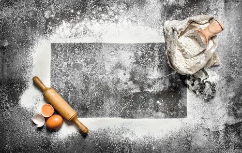 Preview: Baking background. A frame of flour with a rolling pin and fresh eggs.