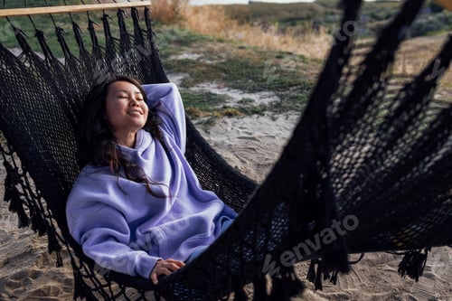 Preview: A beautiful Korean woman in casual clothes enjoys outdoors.