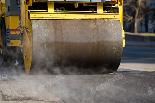 Preview: Compact steamroller flatten out the asphalt