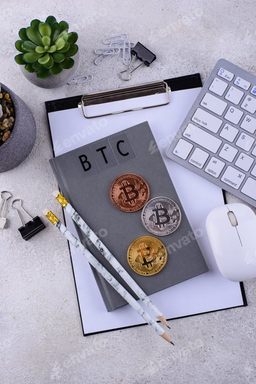 Preview: Bitcoin coins on office desk. Cryptocurrency concept