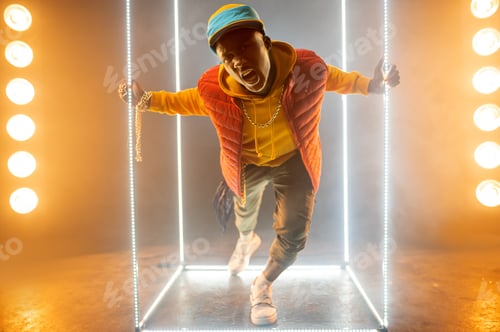 Preview: Stylish rapper on the stage with illuminated cube
