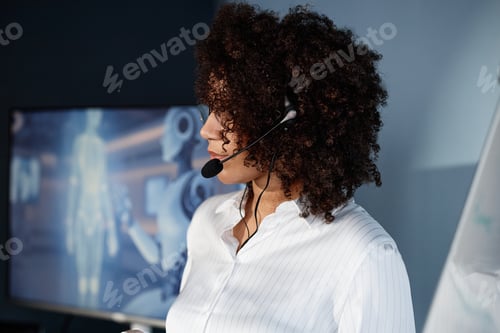 Preview: Black Female Speaker Wearing Mic Presenting AI Technologies at Business Forum