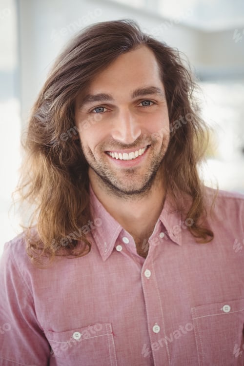 Preview: Portrait of cheerful hipster in office
