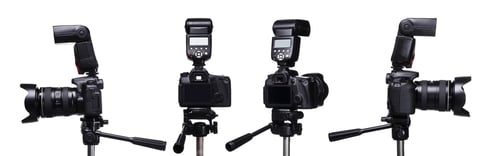 Preview: Multiple angles of DSLR cameras with external flash units isolated on white background