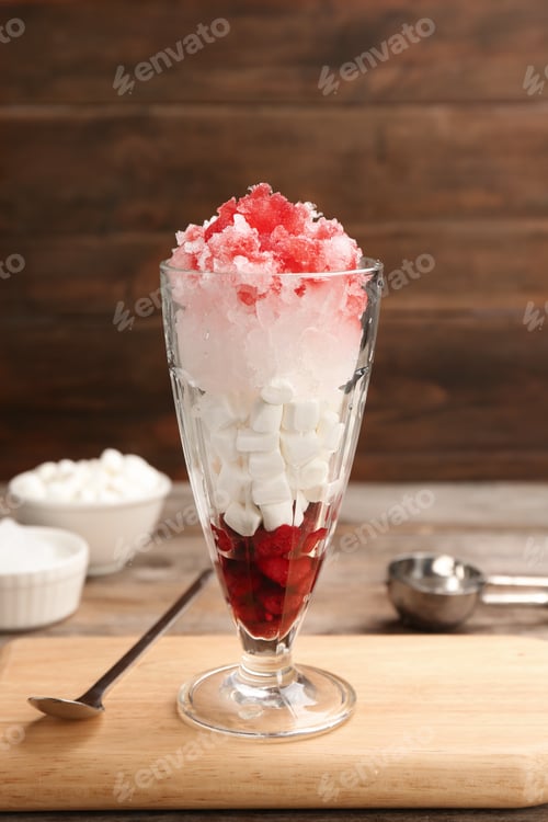 Preview: Glass of snow ice cream with raspberry and marshmallow on table against wooden background