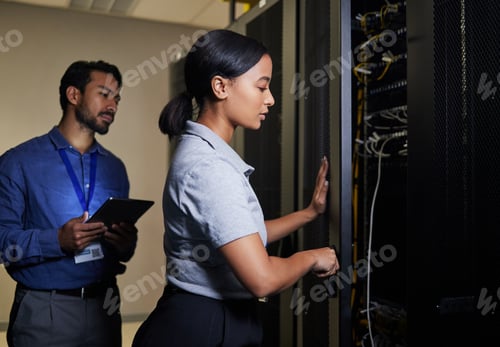 Preview: Server room, engineer teamwork and woman opening panel for maintenance or repairs at night. Cyberse