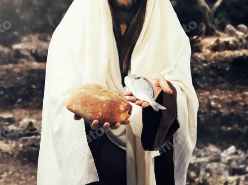 Preview: Jesus christ holding bread and fish for miracle of five loaves and two fish