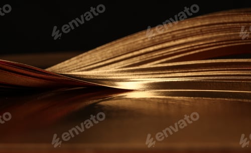 Preview: Soft focus Abstract background. Gold (bronze) paper wave on black.