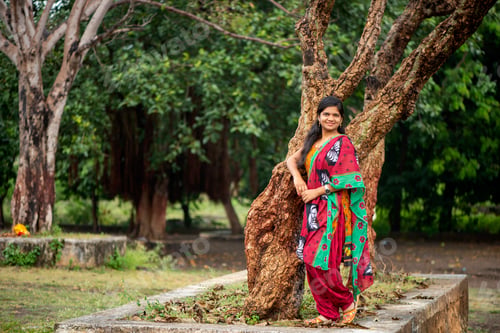 Preview: Happy young beautiful Indian woman at the park outdoor