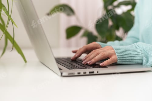 Preview: close-up of business woman hand typing and using laptop keyboard for searching with technology