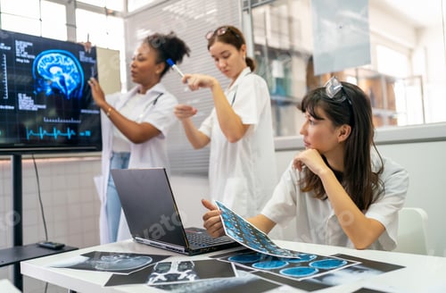 Preview: Team of doctors discuss results of X-Ray or MRI scan of patient's brain in medicine office of clinic