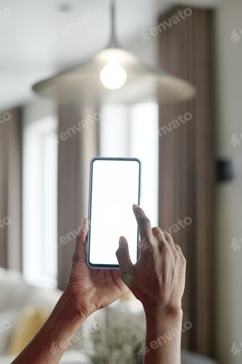 Using a Smartphone in Brightly Lit Home Interior
