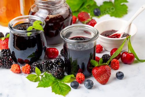 Preview: Fresh berries and jar of a homemade jam