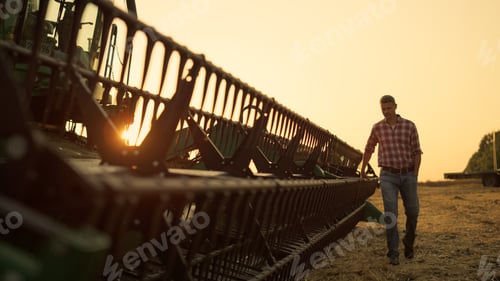 Preview: Worker inspect combine thresher countryside at golden sunset. Farming vehicle