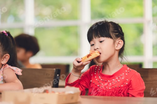 Preview: Cheerful Asian Kids Enjoy Eating Pizza With Friends at School Party.