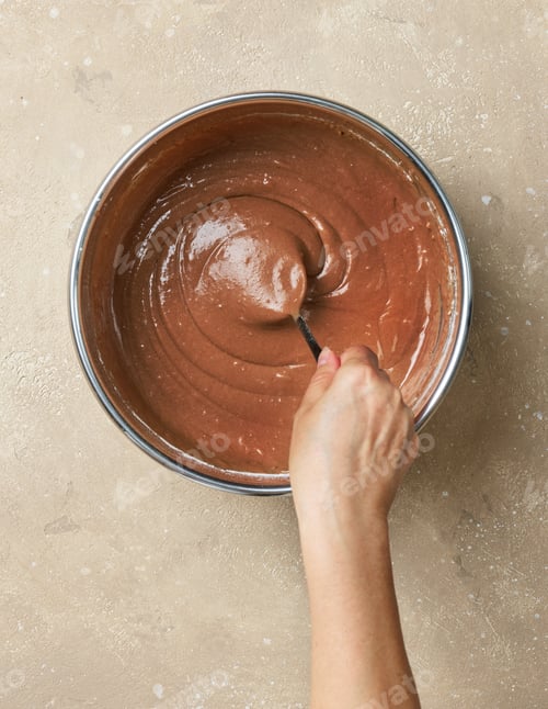 Preview: mixing cocoa powder in metal bowl with dough