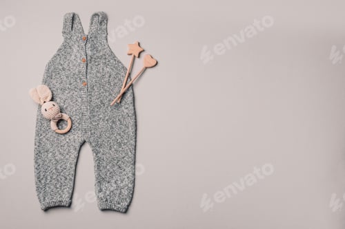 Preview: Knitted romper, wooden toys, teether, crocketed toy. Set of baby stuff and accessories
