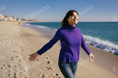 Preview: Beautiful woman happy and relaxed on the beach