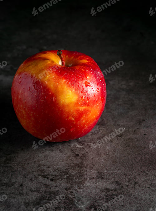 Preview: Apples in a dramatic low key concept with a dark background in variety angles