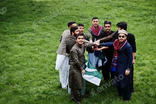 Preview: Group of pakistani man wearing traditional clothes salwar kameez or kurta with Pakistan flags.