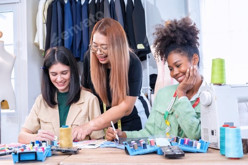 Preview: Senior fashion designer teamwork discuss teach learner final design share idea in shop lady tailor
