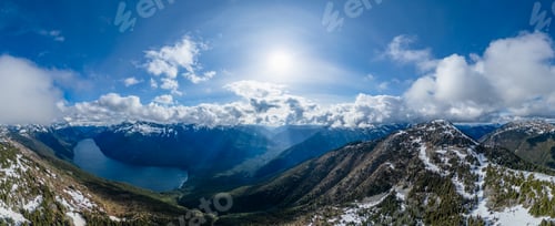 Preview: Aerial Canadian Mountain Landscape. Sunny Cloudy Day. BC, Canada.