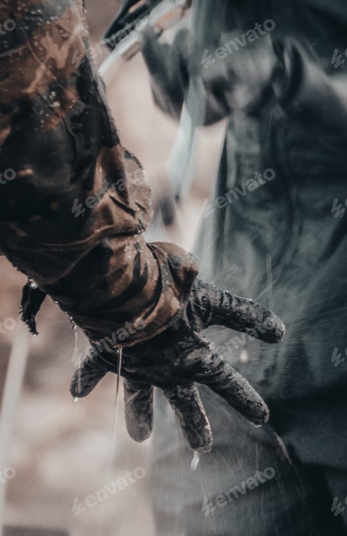 Preview: Closeup shot of a soldier disinfection process- perfect for Army during the COVID-19 concept