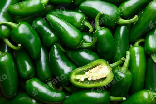 Preview: Top view of green mexican jalapeno hot peppers close up