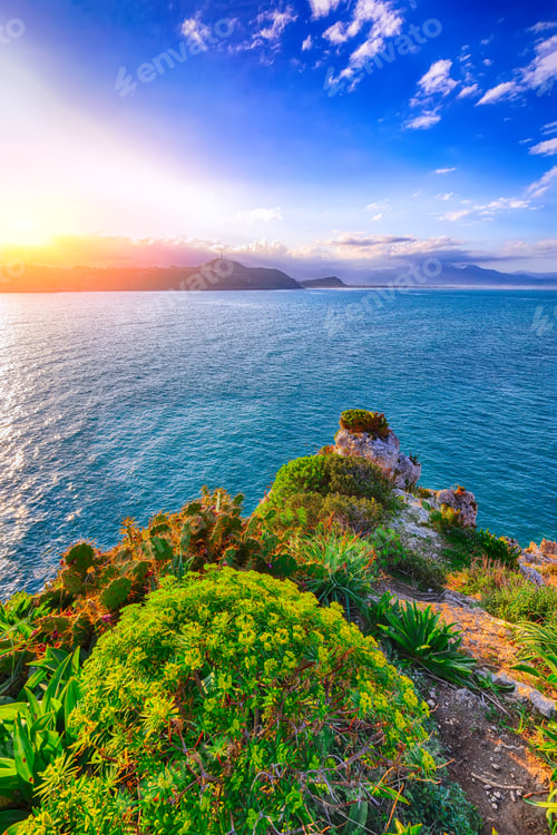 Preview: Dramatic spring sunset on the the cape Milazzo panorama of nature reserve Piscina di Venere.