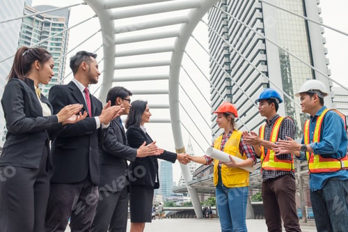 Preview: Group of business people with engineer partner handshake with contract agreement of business project