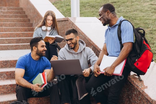 Preview: Diverse Group of Students Collaborating on a Project Outdoors on Campus Steps