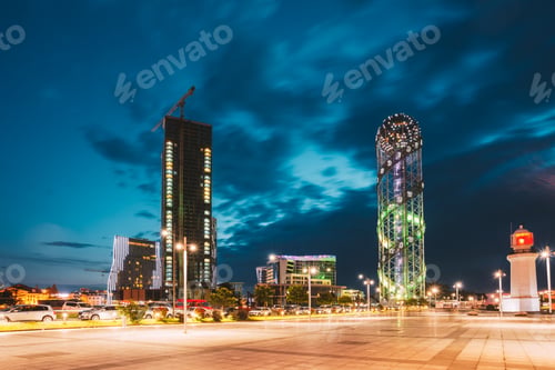 Preview: Batumi, Adjara, Georgia. Illuminated Alphabet Tower And Lighthouse At Promenade Near Miracle Park