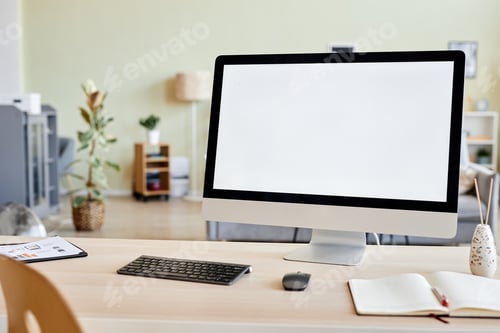 Preview: Background of blank computer screen mockup at workplace desk in home office