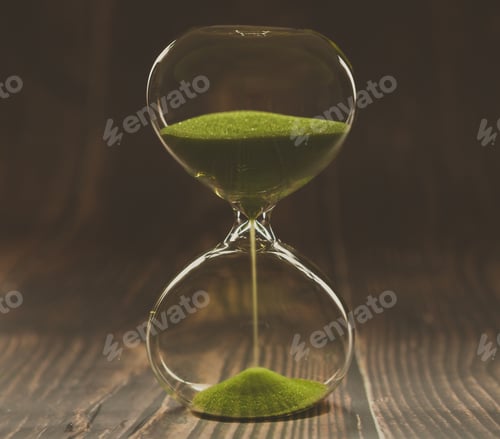 Preview: hourglass on dark background, vintage wooden and color tone