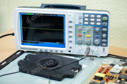 Preview: An electrician measures the voltage while repairing an LSD TV in a service center.