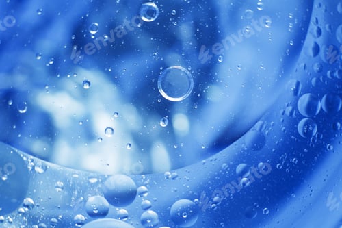Preview: Oil bubbles close up. circles of water macro. abstract light blue background