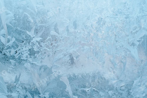Preview: Textured surface of frozen window glass on winter day. Drawings of frost and ice on glass