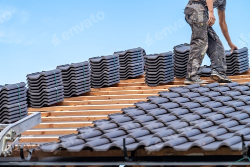 Preview: craftsman laying fired ceramic tiles on the roof