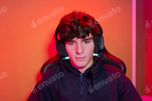 Preview: Young man in headset in neon illumination