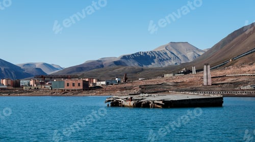 Preview: Abandoned Pyramiden settlement along the blue waters of Svalbards Arctic landscape