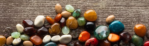 Preview: Top view of fortune telling stones on wooden surface, panoramic shot