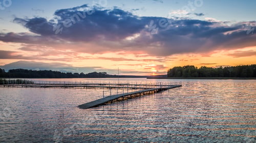 Preview: Stunning sunset at the lake with dynamic sky, Poland