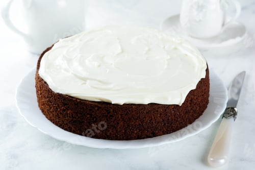 Preview: Carrot cake with cream on light background. Selective focus